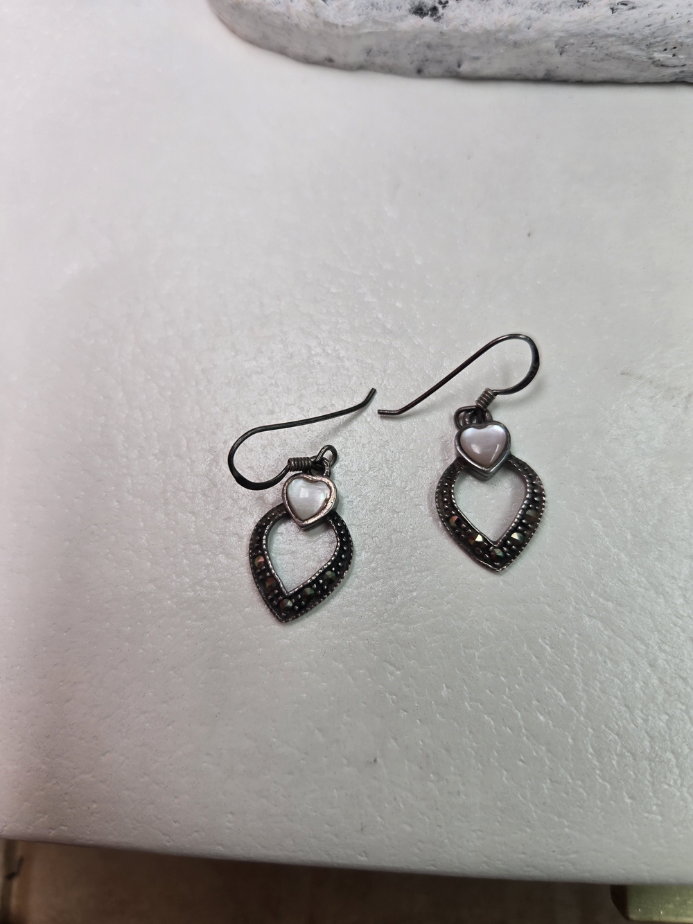 Boma sterling silver heart dangle earrings featuring white mother of pearl